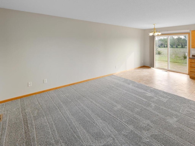 11023 171st Ave SE, Becker, MN 55308 - unfurnished room with a chandelier, baseboards, and carpet flooring