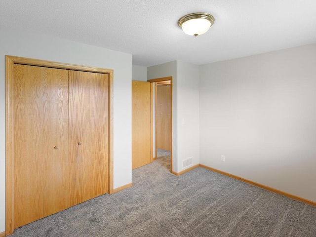 11023 171st Ave SE, Becker, MN 55308 - unfurnished bedroom with carpet flooring, a closet, and baseboards