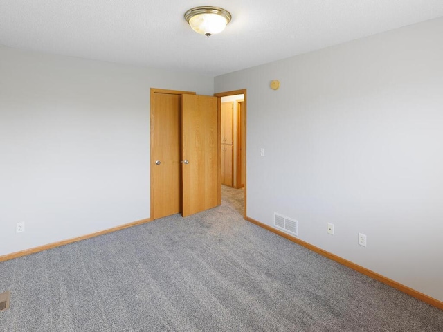 11023 171st Ave SE, Becker, MN 55308 - spare room with carpet floors, baseboards, and a smoke detector