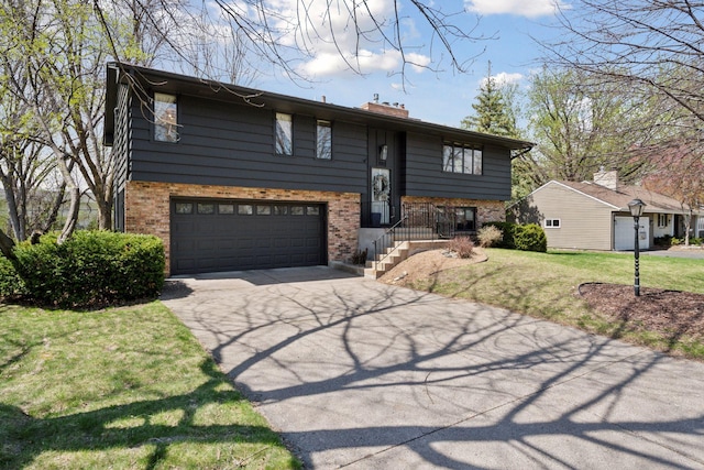 7012 Sally Ln, Edina, MN 55439 - bi-level home with asphalt driveway, brick siding, an attached garage, a chimney, and a front lawn