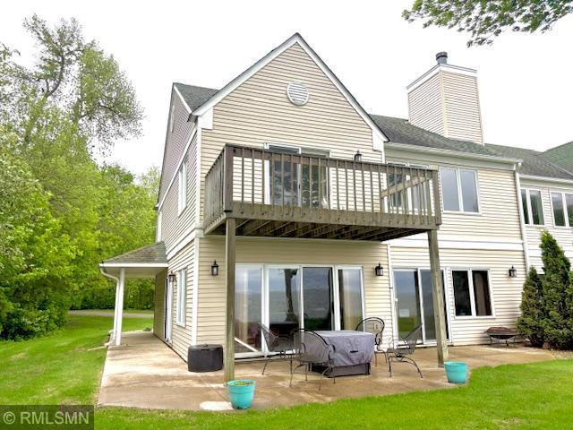 8012 Par Five Dr, South Harbor Twp, MN 56359 - back of house featuring a patio, a yard, and a chimney