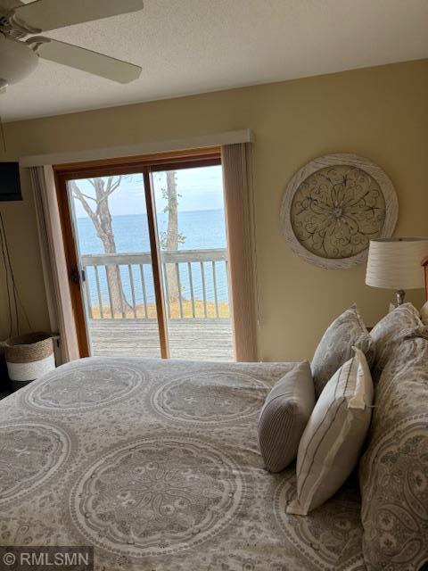 8012 Par Five Dr, South Harbor Twp, MN 56359 - bedroom with access to outside, a water view, multiple windows, and ceiling fan
