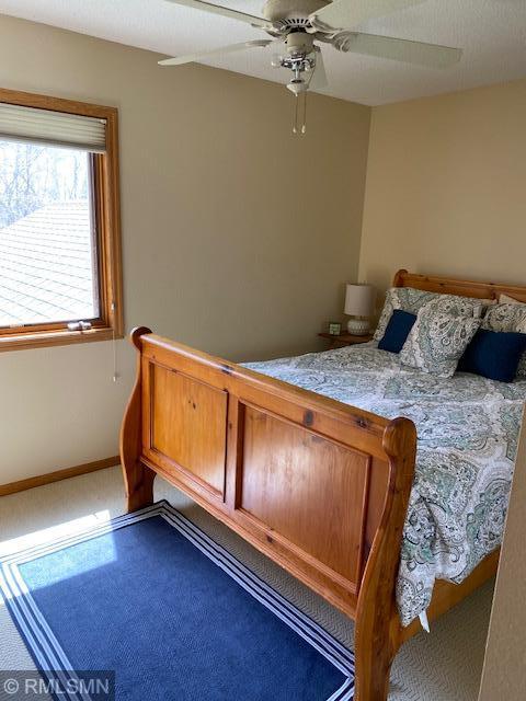 8012 Par Five Dr, South Harbor Twp, MN 56359 - bedroom featuring a ceiling fan and baseboards