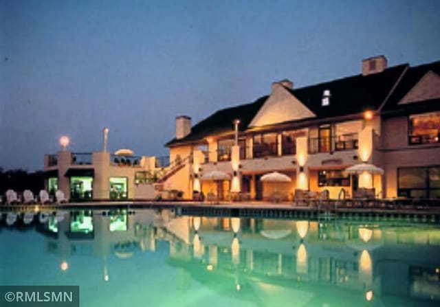 8012 Par Five Dr, South Harbor Twp, MN 56359 - pool at night with a community pool