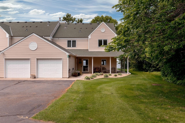 8012 Par Five Dr, South Harbor Twp, MN 56359 - view of front facade with a porch, asphalt driveway, a garage, a shingled roof, and a front yard