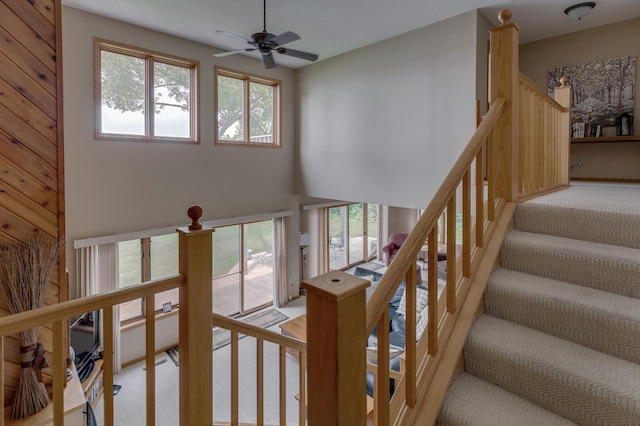 8012 Par Five Dr, South Harbor Twp, MN 56359 - staircase featuring ceiling fan, carpet, and a high ceiling