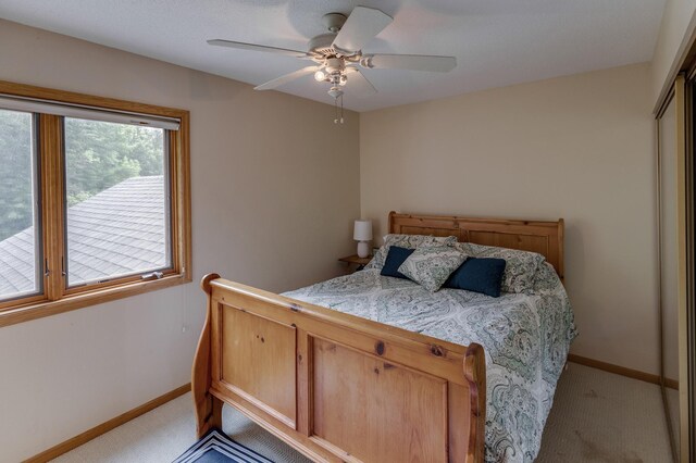 8012 Par Five Dr, South Harbor Twp, MN 56359 - bedroom featuring light carpet, ceiling fan, and a closet