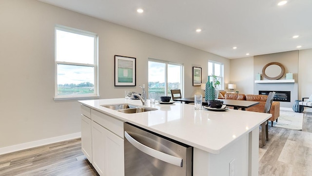 6562 208th St W, Farmington, MN 55024 - kitchen with dishwasher, a sink, a glass covered fireplace, open floor plan, and recessed lighting