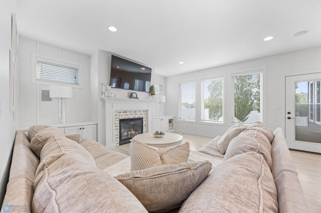 508 13th St NE, Dilworth, MN 56529 - living room with a fireplace, light wood-style flooring, and recessed lighting
