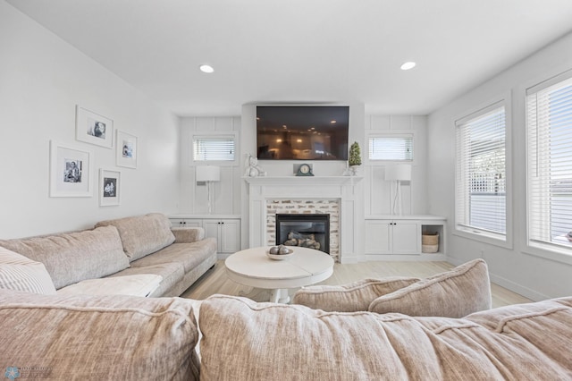 508 13th St NE, Dilworth, MN 56529 - living area featuring healthy amount of natural light, a fireplace, light wood-style floors, recessed lighting, and baseboards