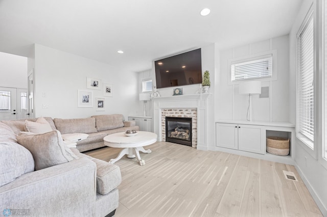508 13th St NE, Dilworth, MN 56529 - living area with a tile fireplace, light wood-style floors, and recessed lighting