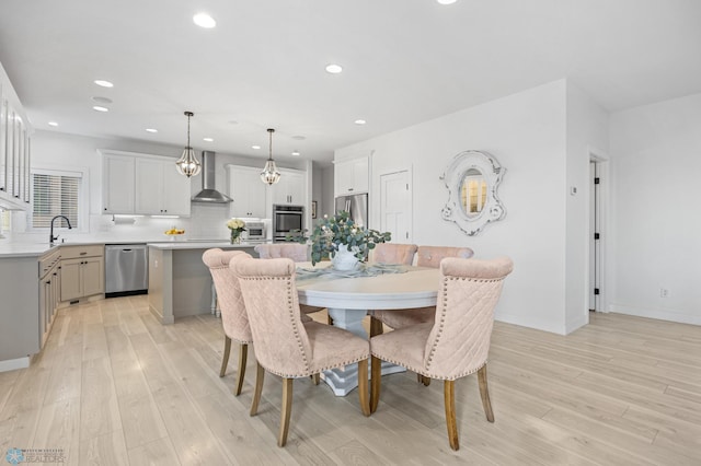 508 13th St NE, Dilworth, MN 56529 - dining space featuring light wood finished floors, recessed lighting, and baseboards