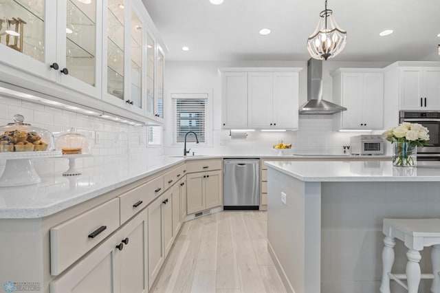 508 13th St NE, Dilworth, MN 56529 - kitchen with dishwasher, wall chimney range hood, a sink, tasteful backsplash, and white cabinets