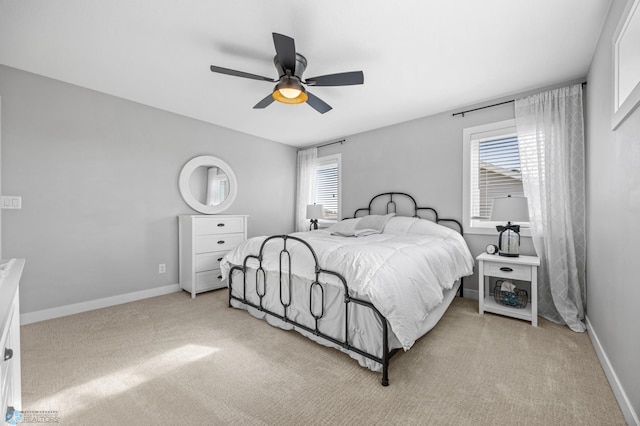 508 13th St NE, Dilworth, MN 56529 - bedroom with light colored carpet, baseboards, and a ceiling fan