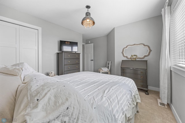508 13th St NE, Dilworth, MN 56529 - bedroom with light colored carpet, baseboards, and a closet