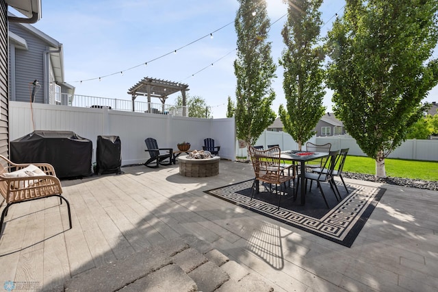 508 13th St NE, Dilworth, MN 56529 - view of patio / terrace with an outdoor fire pit, outdoor dining area, a pergola, and a grill