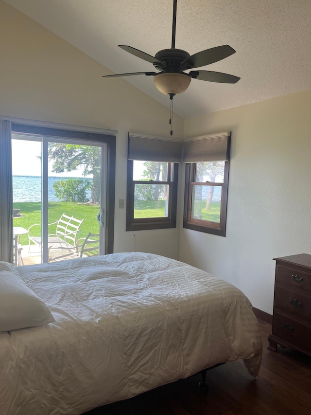 39307 Clearmont Rd, Everts Twp, MN 56515 - bedroom with access to exterior, wood finished floors, lofted ceiling, a ceiling fan, and a textured ceiling