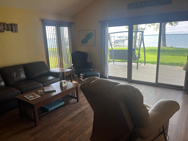 39307 Clearmont Rd, Everts Twp, MN 56515 - living room featuring lofted ceiling, healthy amount of natural light, wood finished floors, and a water view