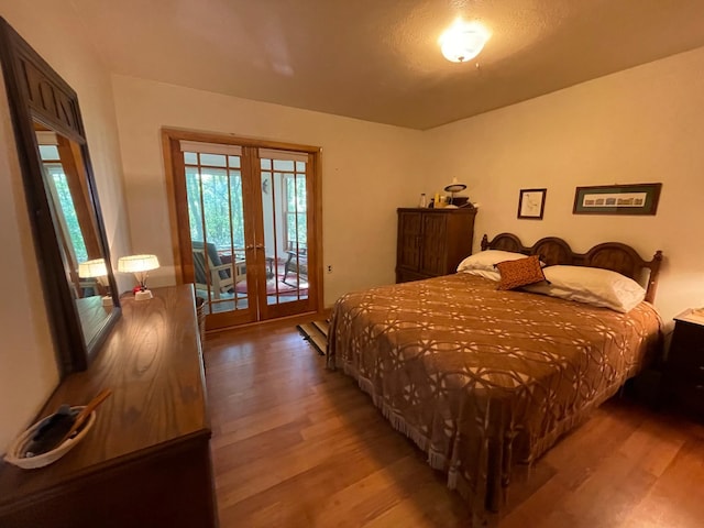 37165 300th Ave NE, Rollis Twp, MN 56724 - bedroom with french doors, light wood-style flooring, and access to exterior