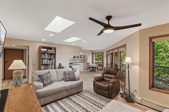 14575 Burma Ave W Unit 306, Rosemount, MN 55068 - living room featuring a baseboard radiator, plenty of natural light, a skylight, light wood-style flooring, and recessed lighting
