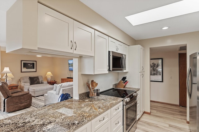14575 Burma Ave W Unit 306, Rosemount, MN 55068 - kitchen with appliances with stainless steel finishes, light wood-style flooring, white cabinets, light stone countertops, and recessed lighting