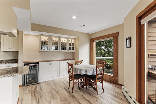 14575 Burma Ave W Unit 306, Rosemount, MN 55068 - dining space with wine cooler, light wood-style floors, baseboard heating, bar area, and recessed lighting