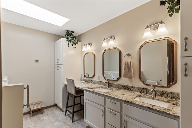 14575 Burma Ave W Unit 306, Rosemount, MN 55068 - bathroom featuring double vanity, a skylight, and baseboards