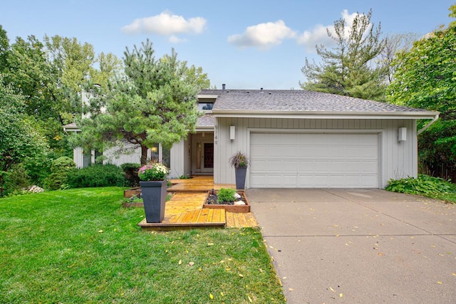view of front of home with an attached garage, a front lawn, driveway, and roof with shingles
