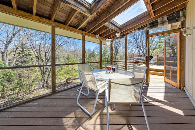 sunroom / solarium with outdoor dining space and a skylight