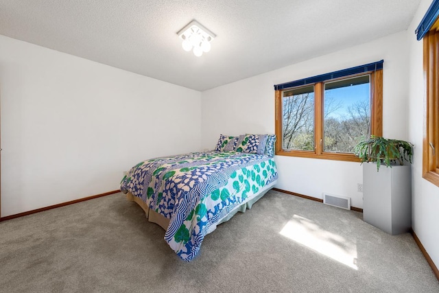 bedroom featuring carpet floors and baseboards