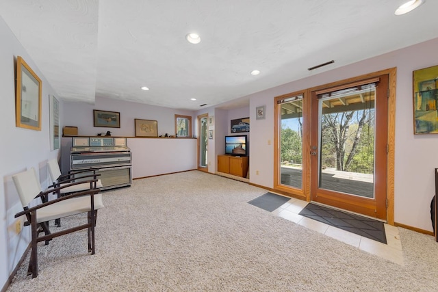 unfurnished room featuring carpet, baseboards, recessed lighting, and tile patterned flooring