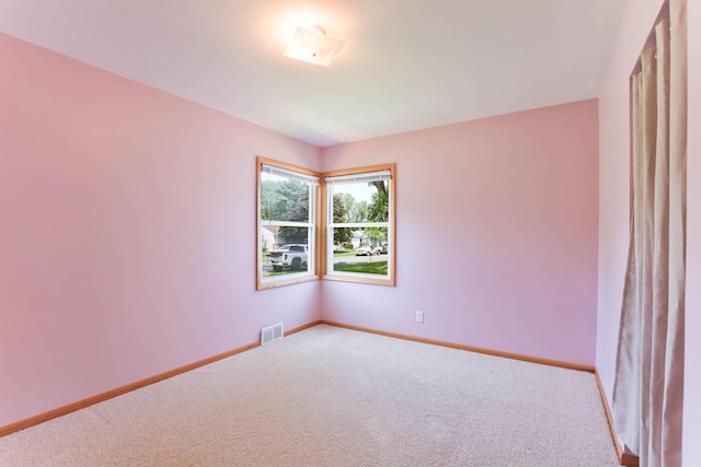 864 Howard St N, Saint Paul, MN 55119 - spare room featuring carpet flooring and baseboards