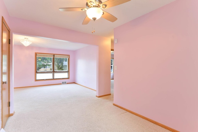 864 Howard St N, Saint Paul, MN 55119 - spare room featuring baseboards, light colored carpet, and a ceiling fan