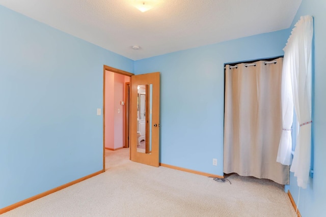864 Howard St N, Saint Paul, MN 55119 - unfurnished bedroom featuring light colored carpet and baseboards