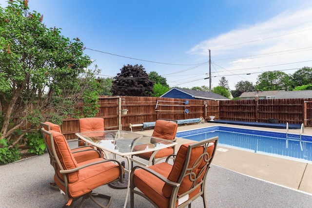 864 Howard St N, Saint Paul, MN 55119 - view of pool featuring a fenced backyard, a patio area, and outdoor dining area