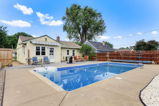 864 Howard St N, Saint Paul, MN 55119 - view of pool with a fenced backyard, a patio area, and grilling area