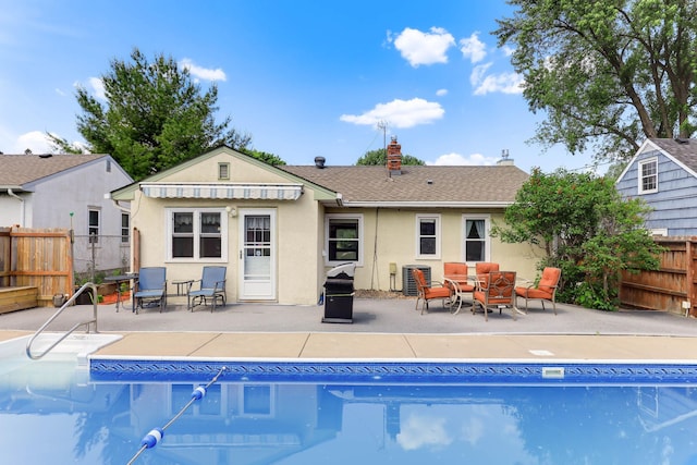 864 Howard St N, Saint Paul, MN 55119 - view of pool with cooling unit and a patio