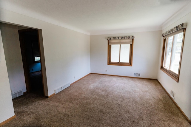 1651 5th St E, Saint Paul, MN 55106 - carpeted spare room featuring baseboards