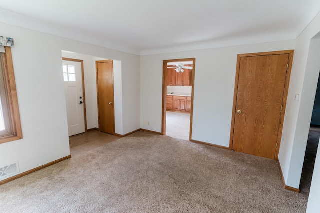 1651 5th St E, Saint Paul, MN 55106 - carpeted empty room featuring baseboards and ceiling fan