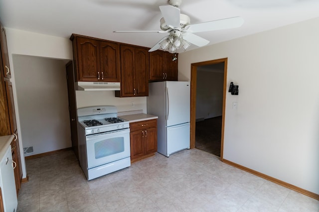 1651 5th St E, Saint Paul, MN 55106 - kitchen featuring white appliances, under cabinet range hood, light countertops, and a ceiling fan