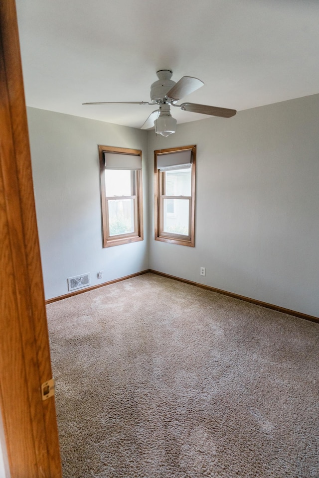 1651 5th St E, Saint Paul, MN 55106 - spare room featuring ceiling fan, carpet, and baseboards