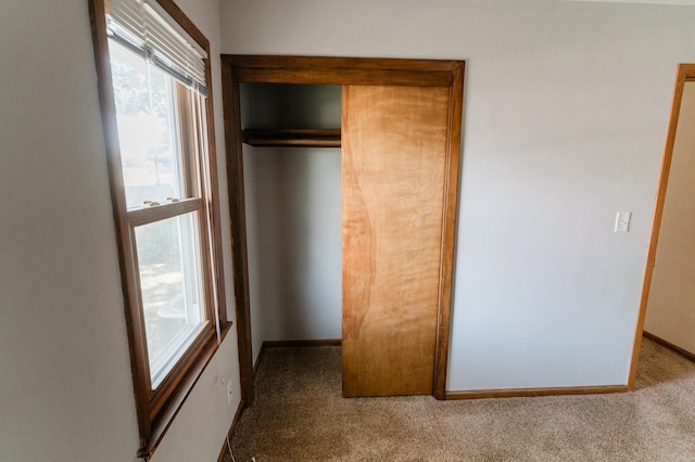 1651 5th St E, Saint Paul, MN 55106 - unfurnished bedroom with carpet floors, a closet, and baseboards