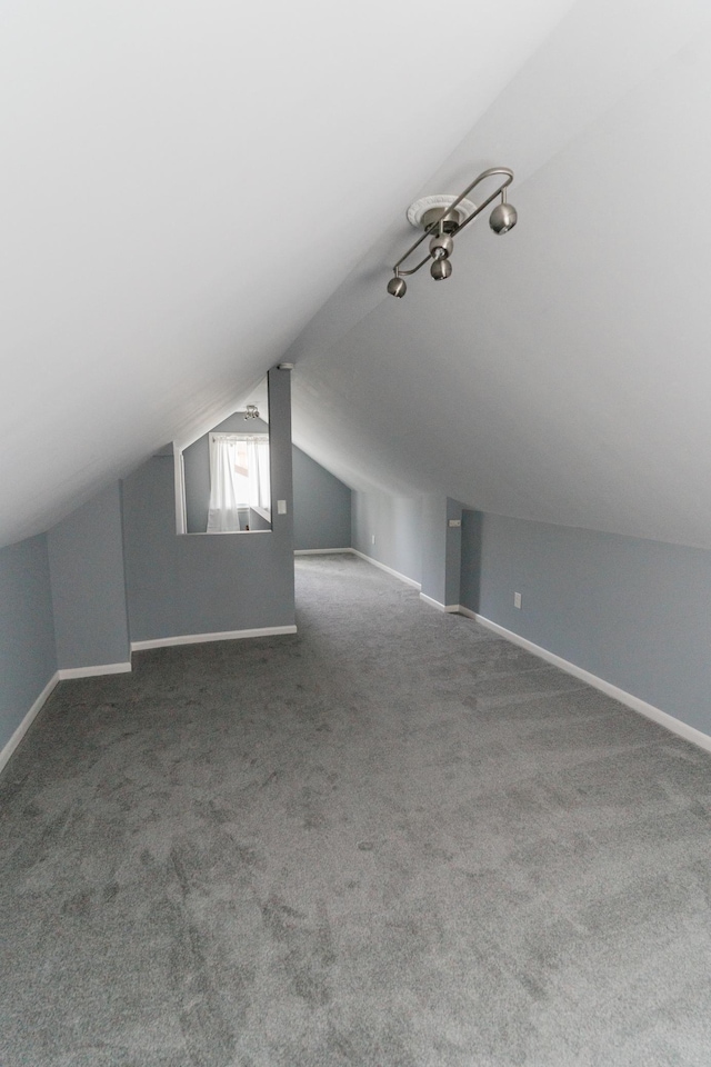 1651 5th St E, Saint Paul, MN 55106 - bonus room featuring lofted ceiling, baseboards, and carpet floors