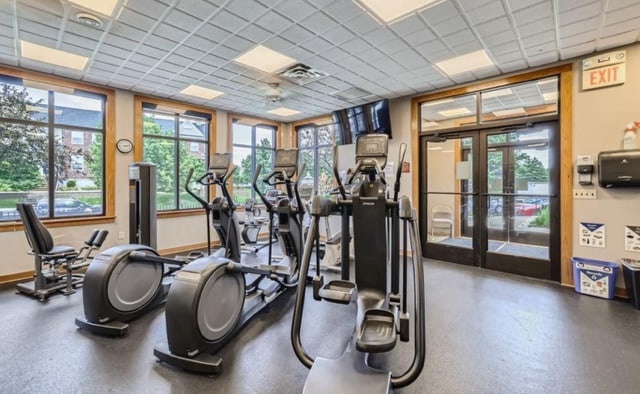 11353 Fergus St NE Unit A, Blaine, MN 55449 - workout area featuring french doors, a drop ceiling, and baseboards