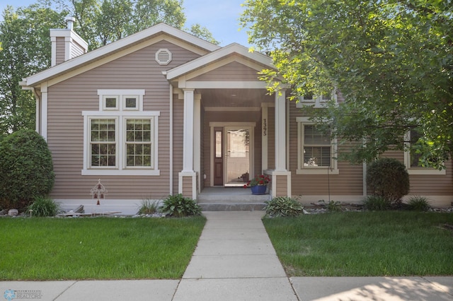 1395 Highpointe Dr N, Fargo, ND 58102 - view of front of home featuring a front yard and a chimney