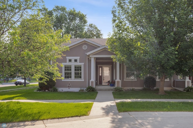1395 Highpointe Dr N, Fargo, ND 58102 - view of property hidden behind natural elements with a front yard