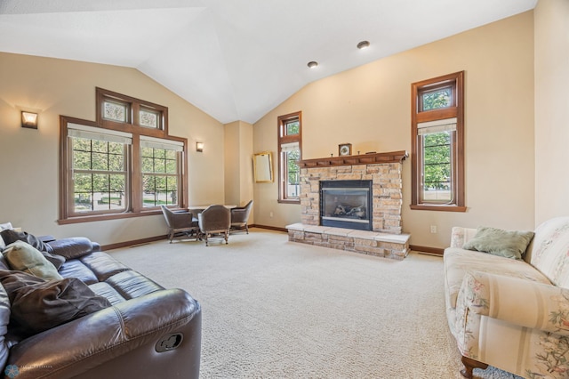 1395 Highpointe Dr N, Fargo, ND 58102 - carpeted living room featuring baseboards, vaulted ceiling, and a fireplace