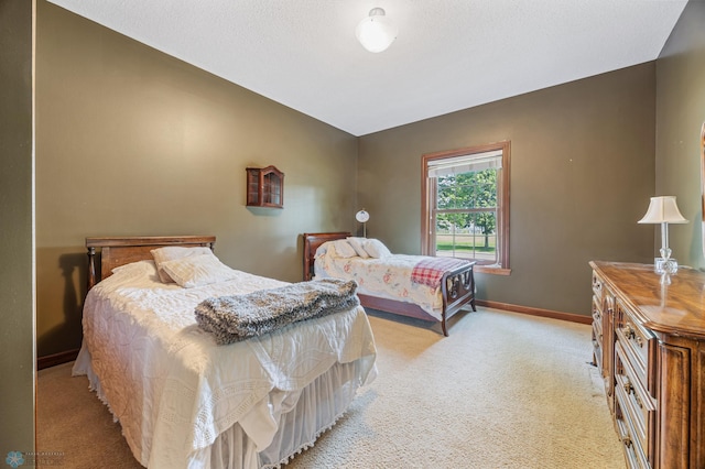 1395 Highpointe Dr N, Fargo, ND 58102 - bedroom with light carpet, baseboards, and lofted ceiling