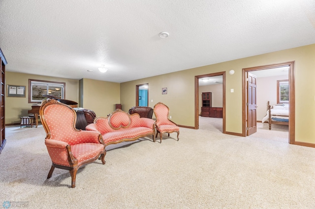1395 Highpointe Dr N, Fargo, ND 58102 - living room with light carpet, a textured ceiling, and baseboards