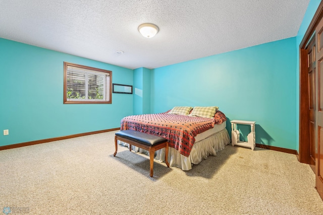 1395 Highpointe Dr N, Fargo, ND 58102 - bedroom featuring carpet flooring, baseboards, a textured ceiling, and a closet
